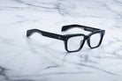 Jacques Marie Mage Molino 55 black rectangular eyeglasses with thick frames, top-down view.