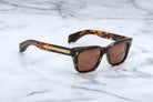 Jacques Marie Mage Molino tortoiseshell square sunglasses with UV-protection brown lenses, viewed from above.