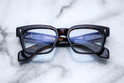 Jacques Marie Mage Walker rectangular tortoiseshell eyeglasses with gold accents, front view.
