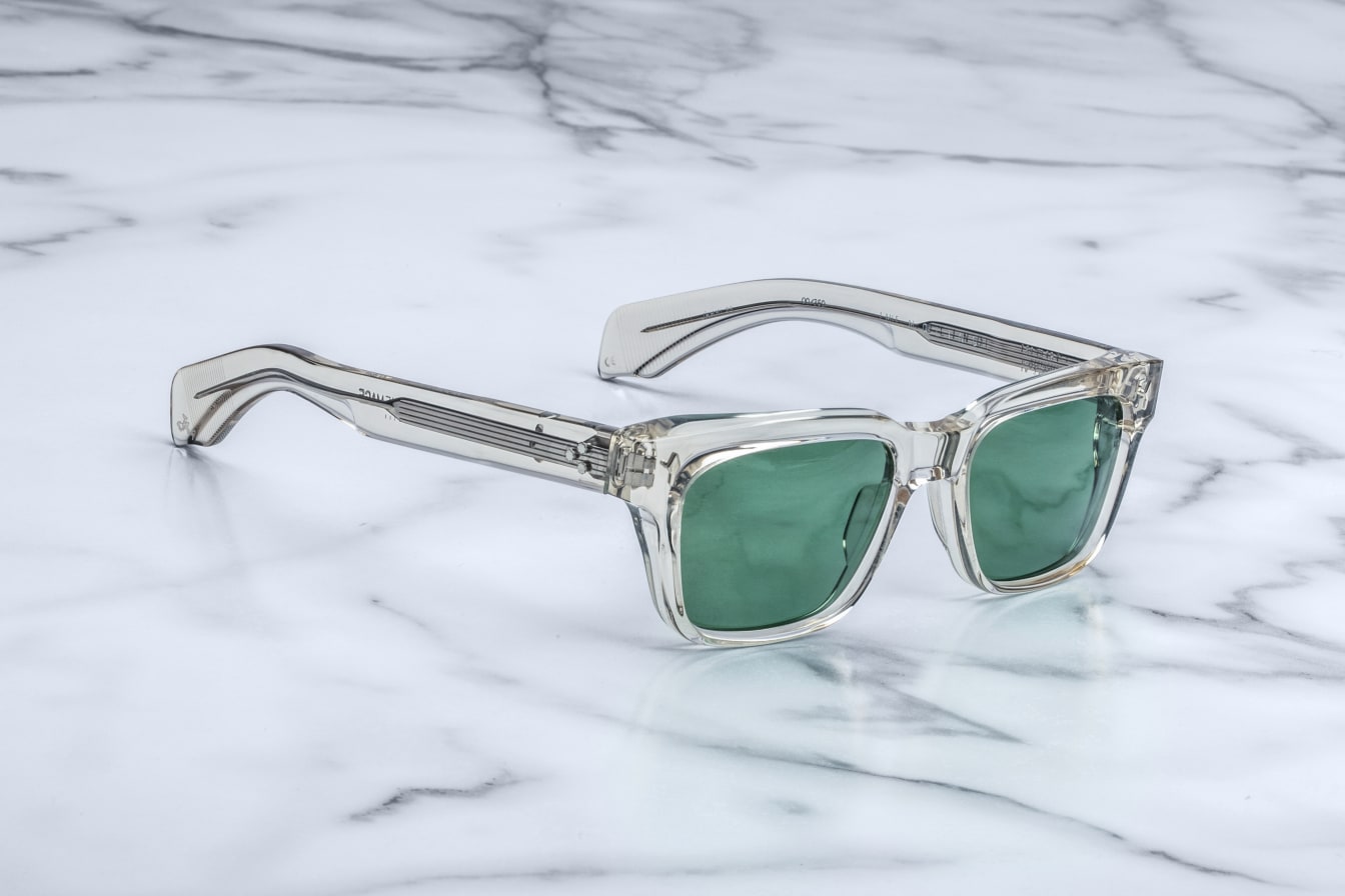 Jacques Marie Mage Molino sunglasses, clear frames, green lenses, front angle view.