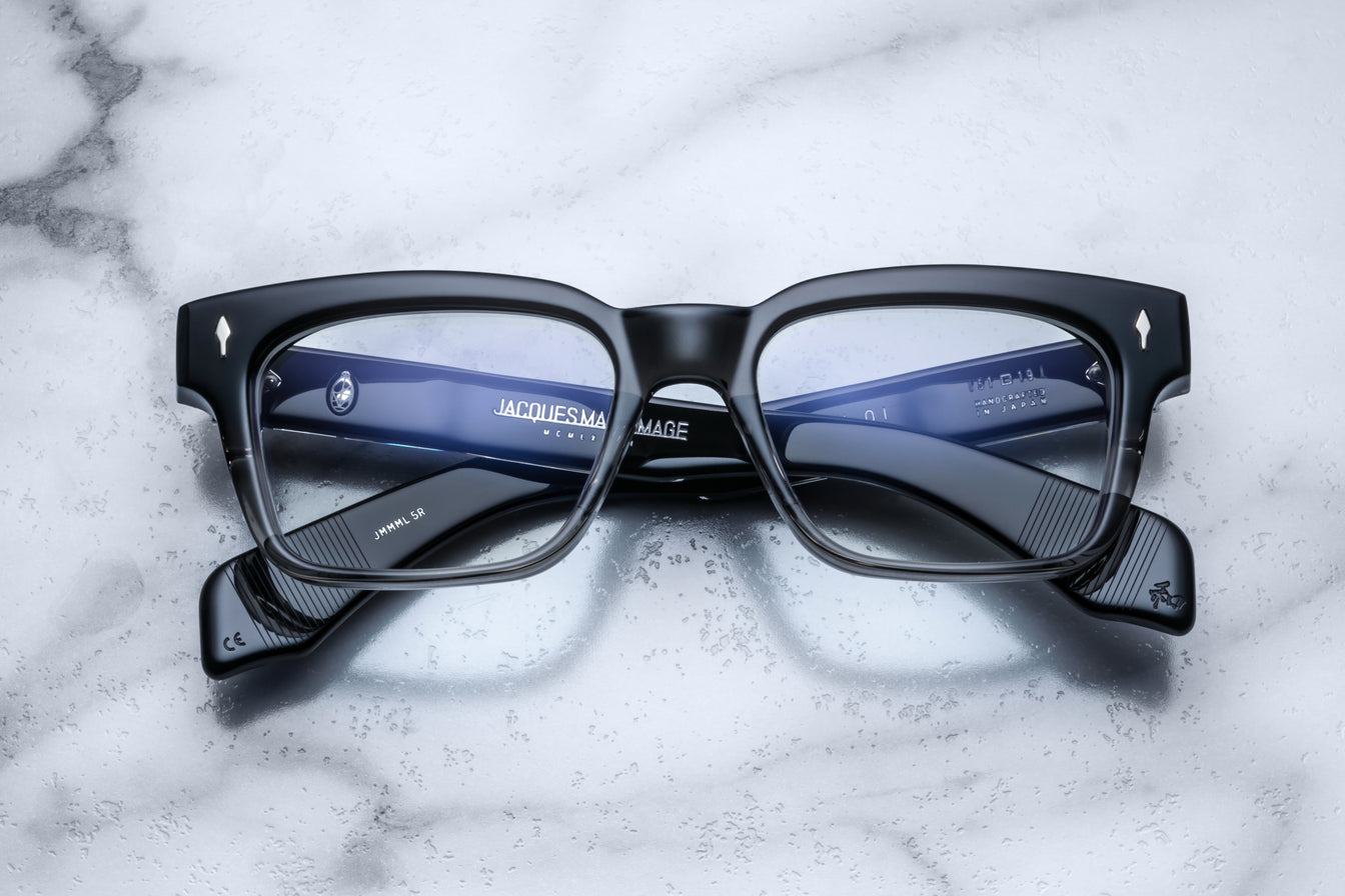 Jacques Marie Mage Walker black rectangular eyeglasses with clear lenses, top view.