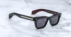 Jacques Marie Mage Molino black rectangular sunglasses with thick frames and silver accents, front view.