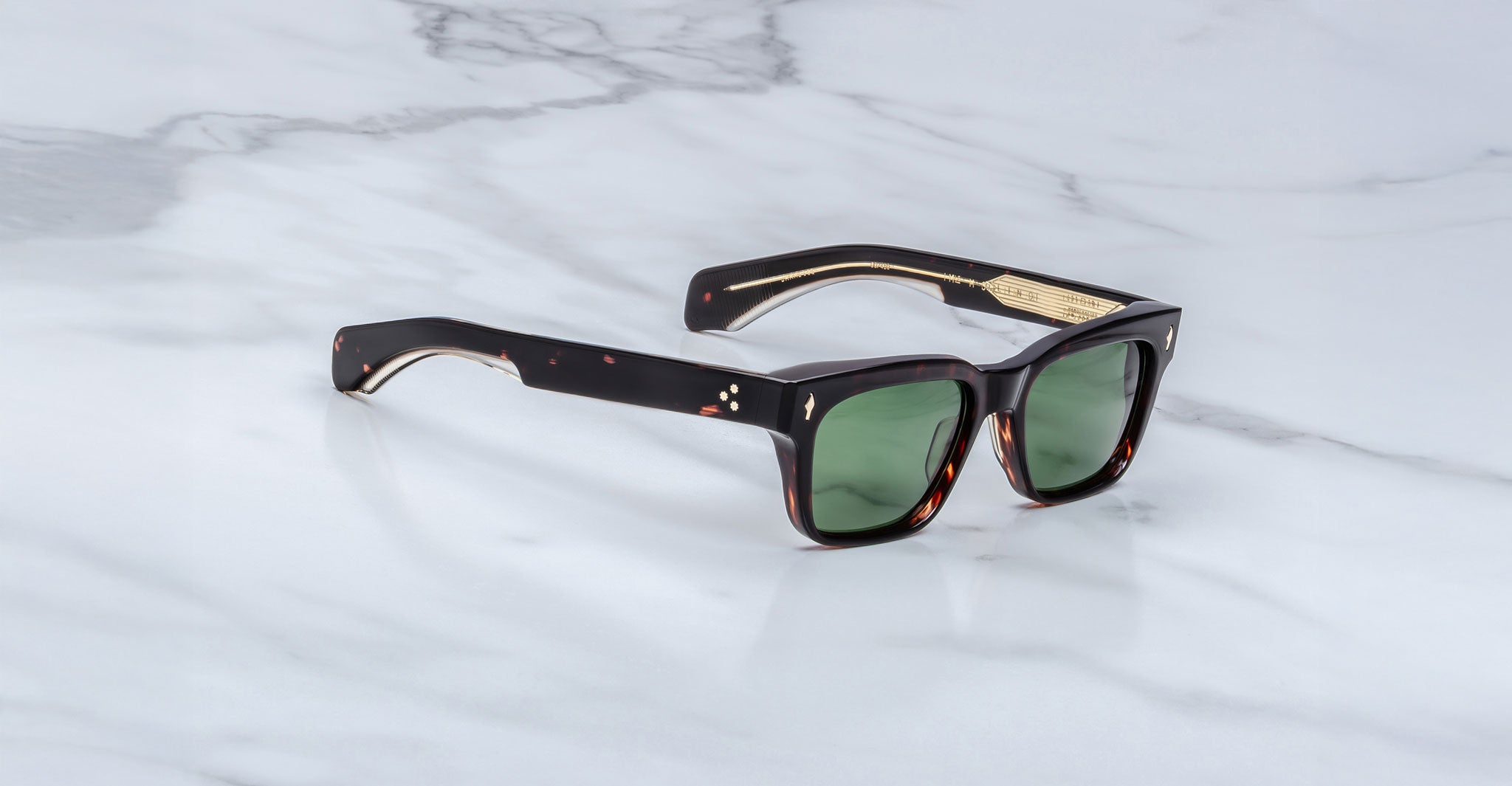 Jacques Marie Mage Molino rectangular tortoiseshell sunglasses with green lenses and gold accents, front view.