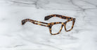 Jacques Marie Mage Molino rectangular eyeglasses with thick tortoiseshell frames, top view.