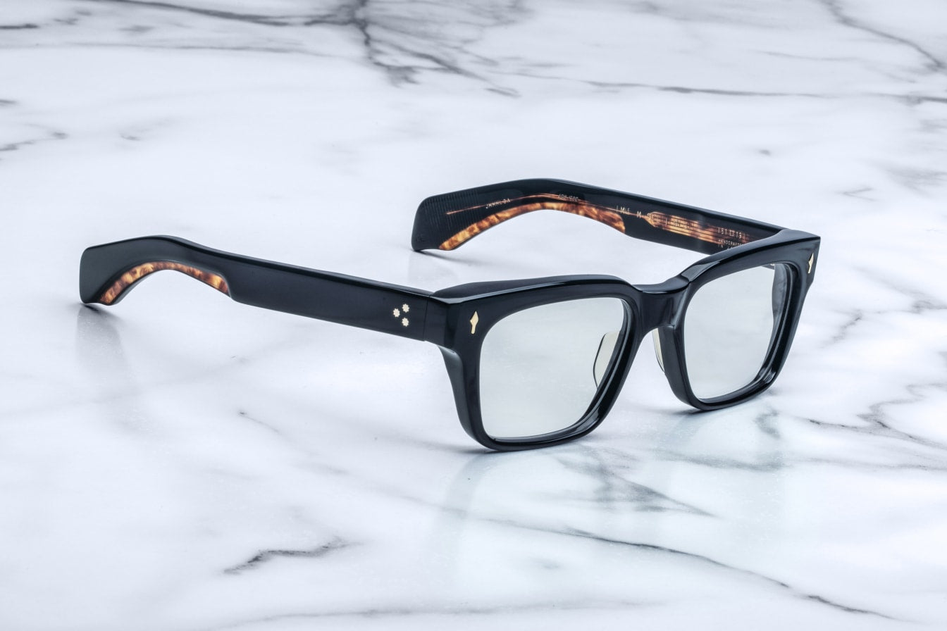 Jacques Marie Mage Molino black rectangular sunglasses with semi-reflective lenses, front view.