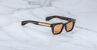 Jacques Marie Mage Molino sunglasses with gold-accented arms, side view.