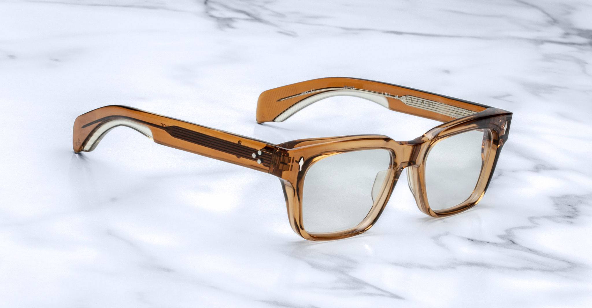 Jacques Marie Mage Molino translucent tortoise square eyeglasses with clear lenses, top-down view.