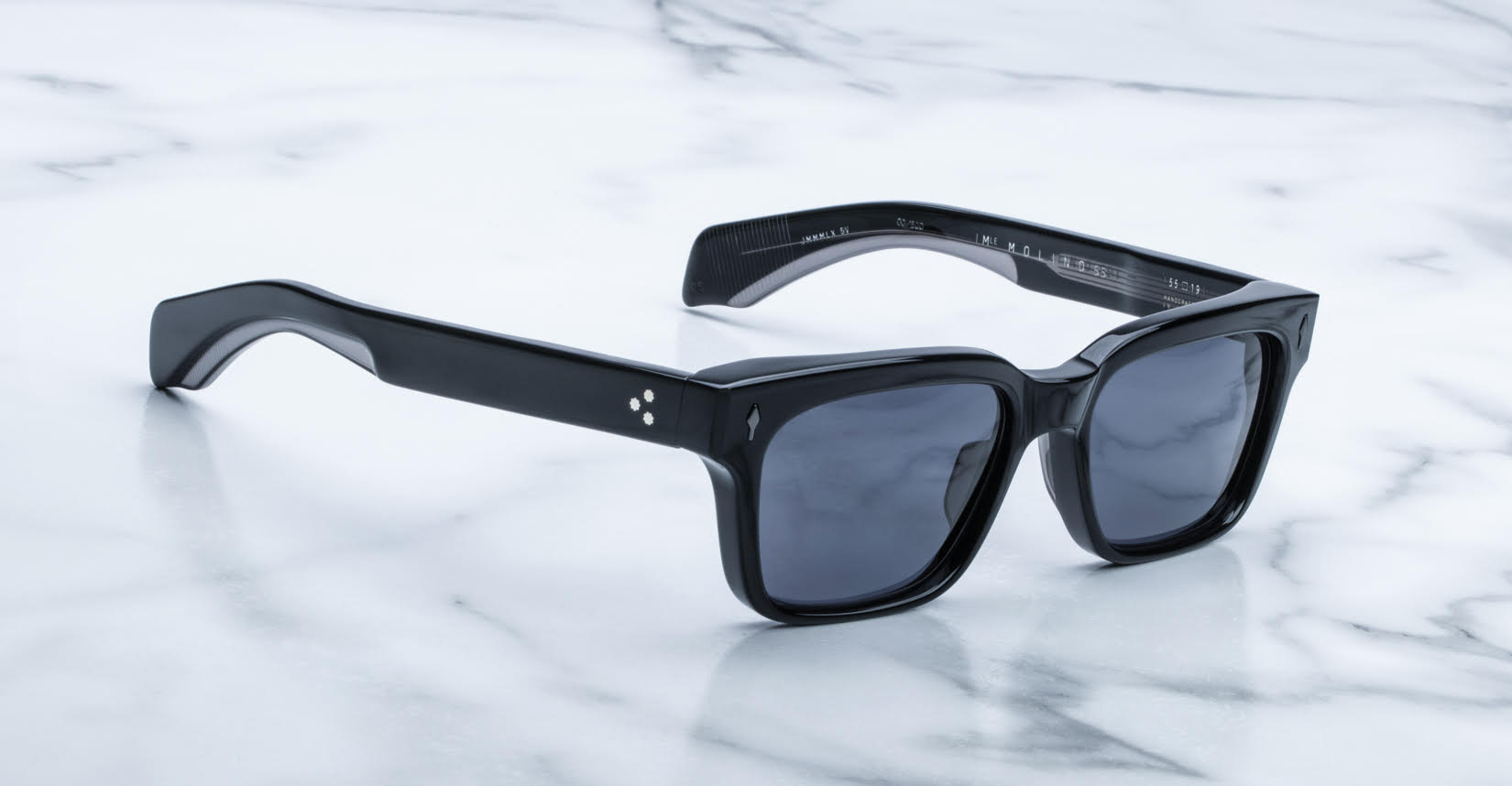 Jacques Marie Mage Molino 55 black rectangular sunglasses with polarized dark lenses, top view.