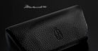 Jacques Marie Mage Kinshasa eyeglasses case, black textured leather with embossed logo, top view.