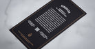 Jacques Marie Mage Kinshasa eyeglasses black card with bold white text and centered QR code, top-down view.
