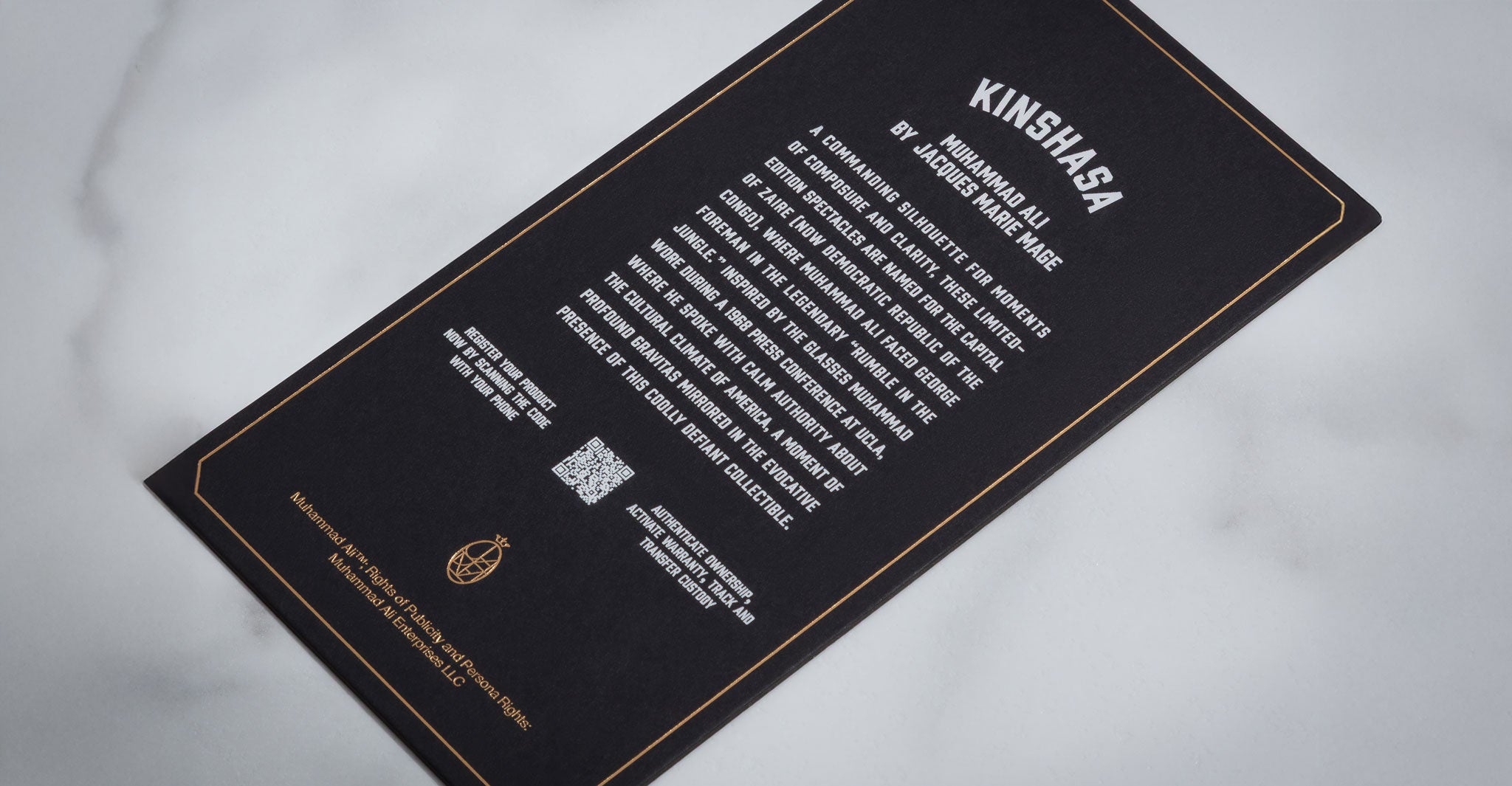 Jacques Marie Mage Kinshasa eyeglasses black card with bold white text and centered QR code, top-down view.