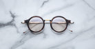 Jacques Marie Mage Norman eyeglasses with clear lenses, front view.