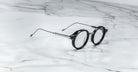 Jacques Marie Mage Norman eyeglasses, round metal frames, front view, display the brand’s classic design.