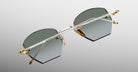 Jacques Marie Mage Oatman in Electrum sunglasses feature pentagon-shaped gold and silver frames, viewed from the back.