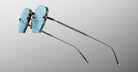 Jacques Marie Mage Oatman in Lagoon rimless sunglasses with UV-protected blue-tinted lenses and thin metal arms, side view.