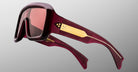 Jacques Marie Mage Pausa oversized sunglasses, burgundy frames with gold arms, front view.