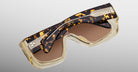 Jacques Marie Mage Pausa sunglasses, tortoiseshell and clear frame, brown lenses, folded; top view showing front and sides.