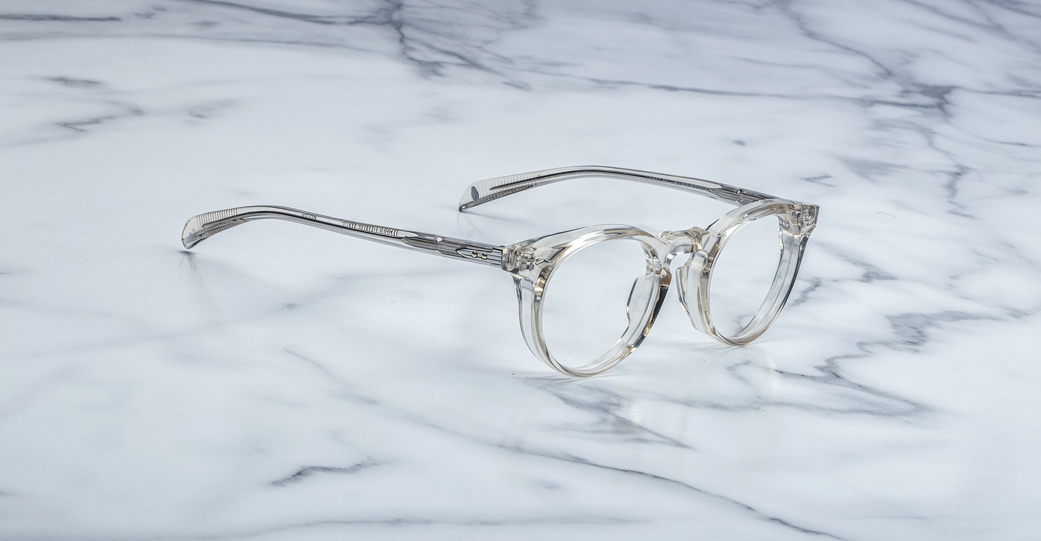 Jacques Marie Mage Percier round clear-framed eyeglasses, top view showing full frame and temples.