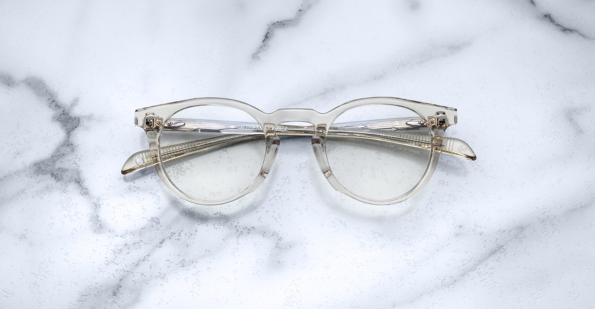 Jacques Marie Mage Percier round eyeglasses with gold accents, top view.
