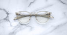 Jacques Marie Mage Percier round eyeglasses with gold accents, top view.