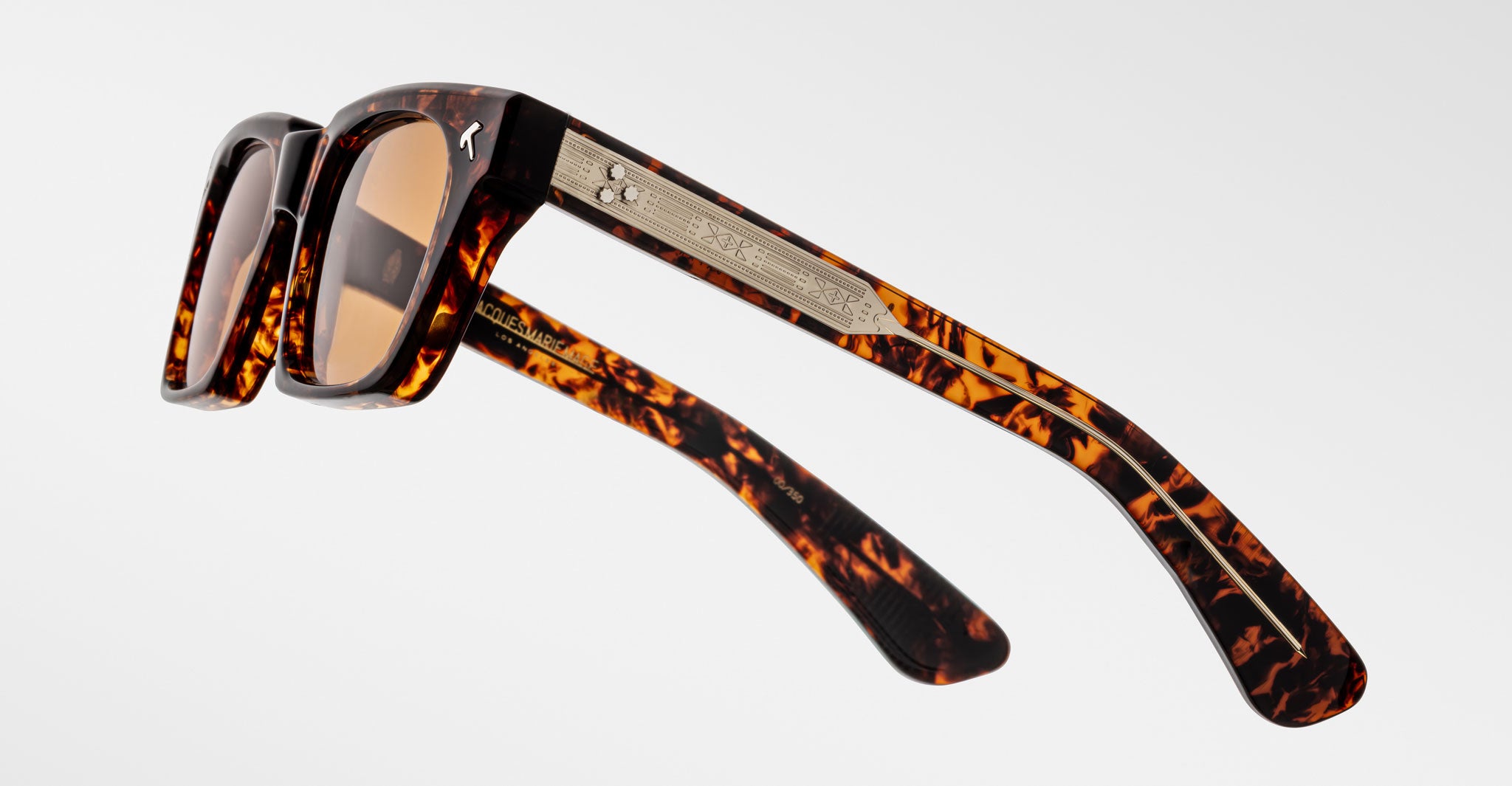Jacques Marie Mage Quentin sunglasses, rectangular tortoiseshell frame with brown lenses and metallic accents, front view.