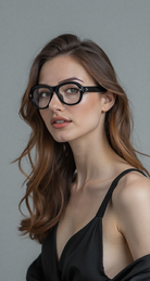 Female model wearing JMMRHRX-01 Jacques Marie Mage Richard sunglasses in Noir, side view in a studio setting