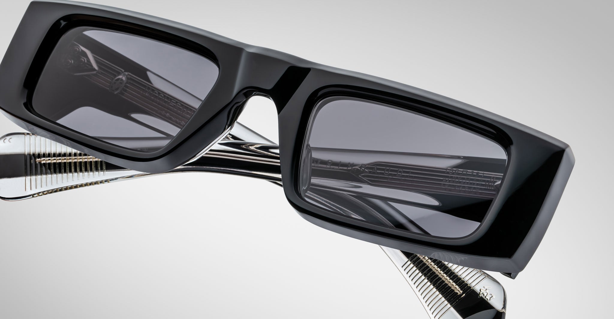 Close-up front view of the Jacques Marie Mage Rimbaud sunglass in black color with grey lenses on a white background