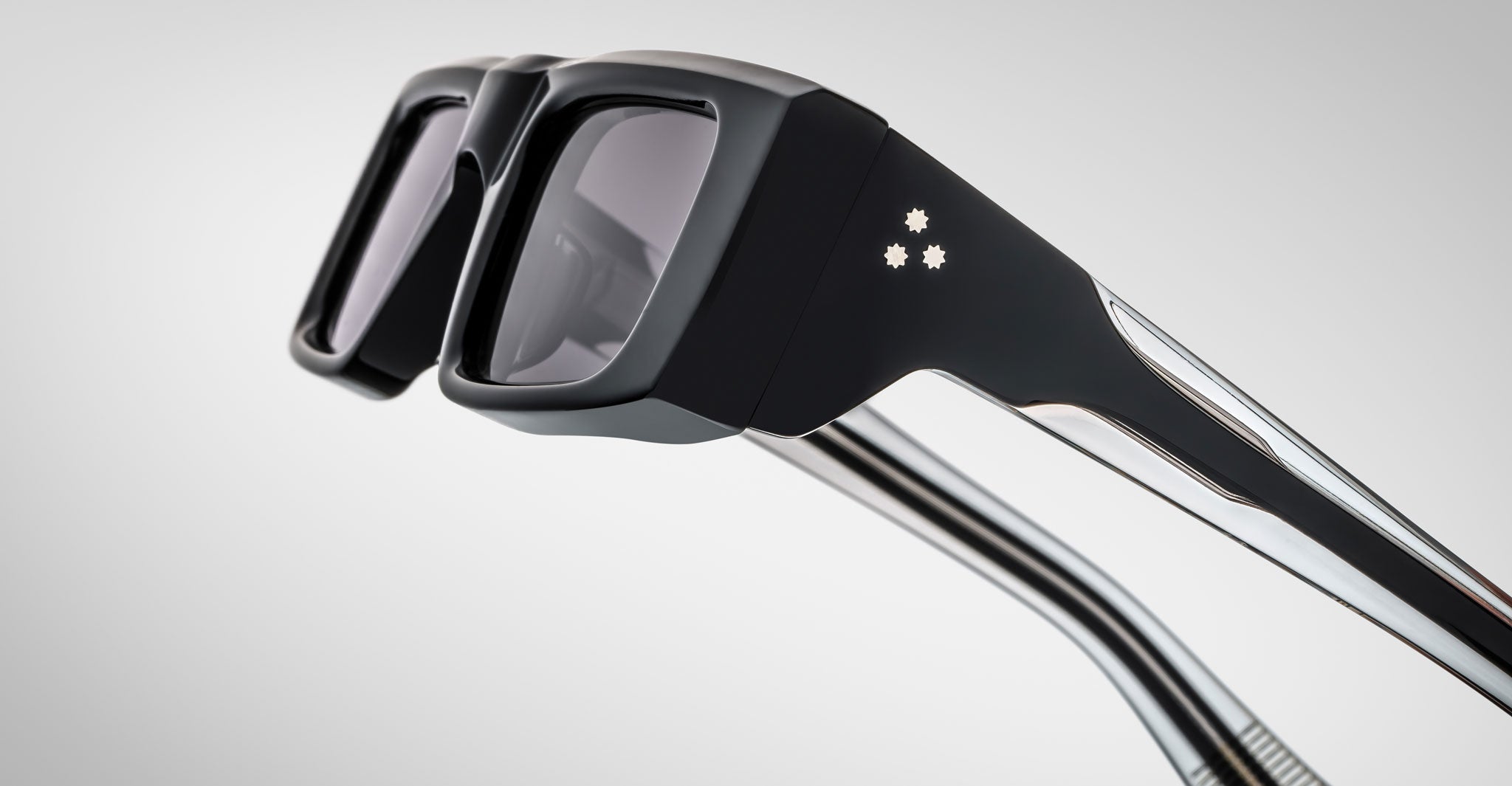 Close-up profile view of the Jacques Marie Mage Rimbaud sunglass in black color with grey lenses on a white background