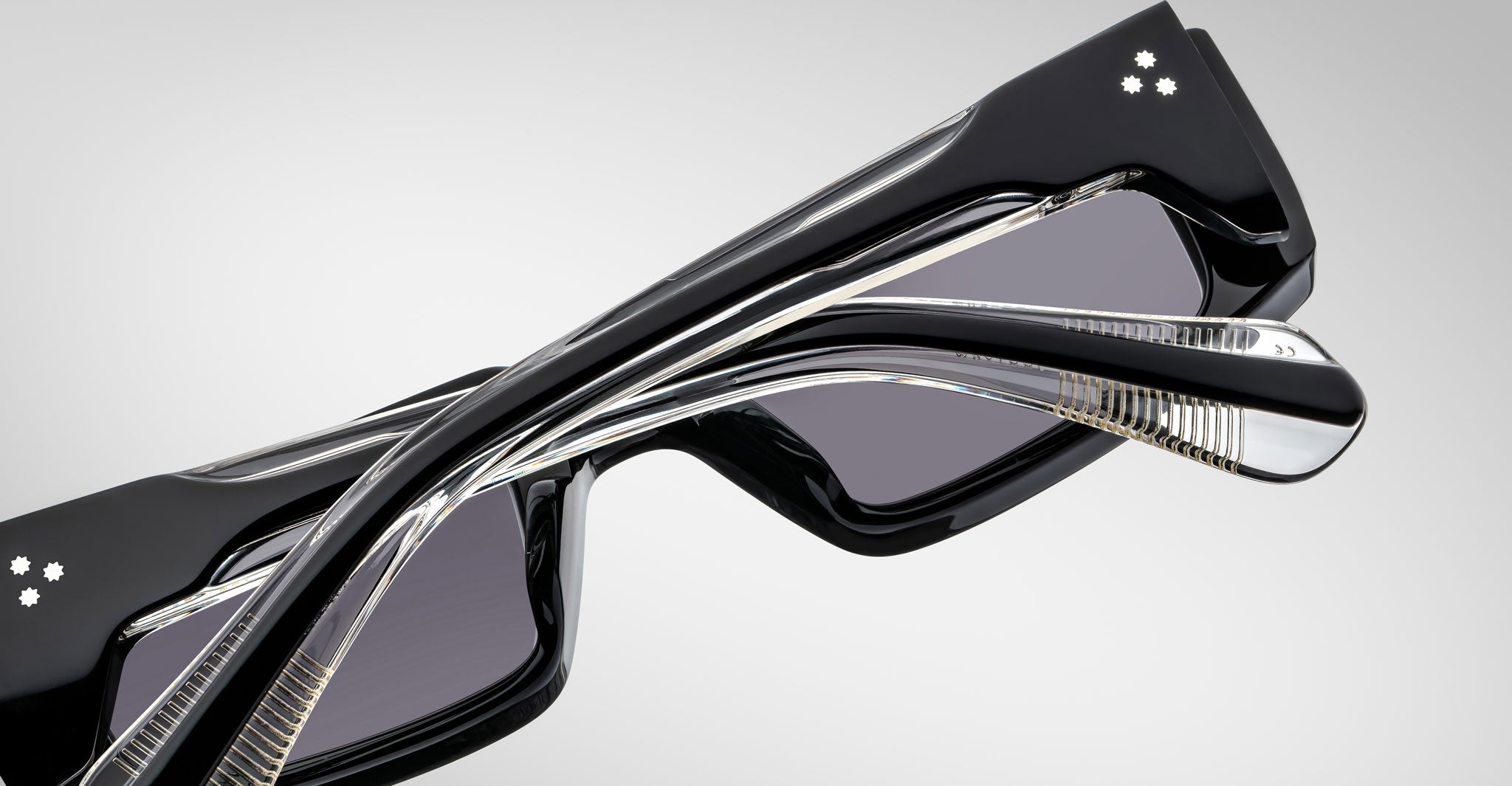 Back view of the Jacques Marie Mage Rimbaud sunglass in black color with grey lenses on a white background