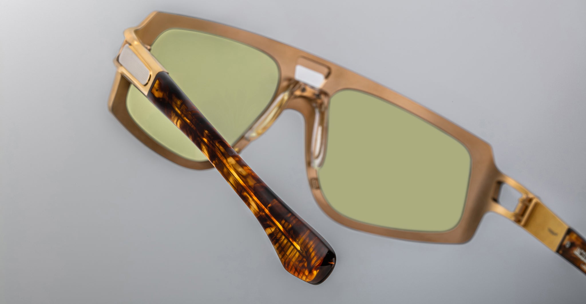Jacques Marie Mage Scarface sunglasses, square shape with light green lenses and slim tortoiseshell arms, front angle view.