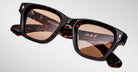 Close-up of Jacques Marie Mage Sonata tortoiseshell square sunglasses with brown lenses, UV protection, front angle view.