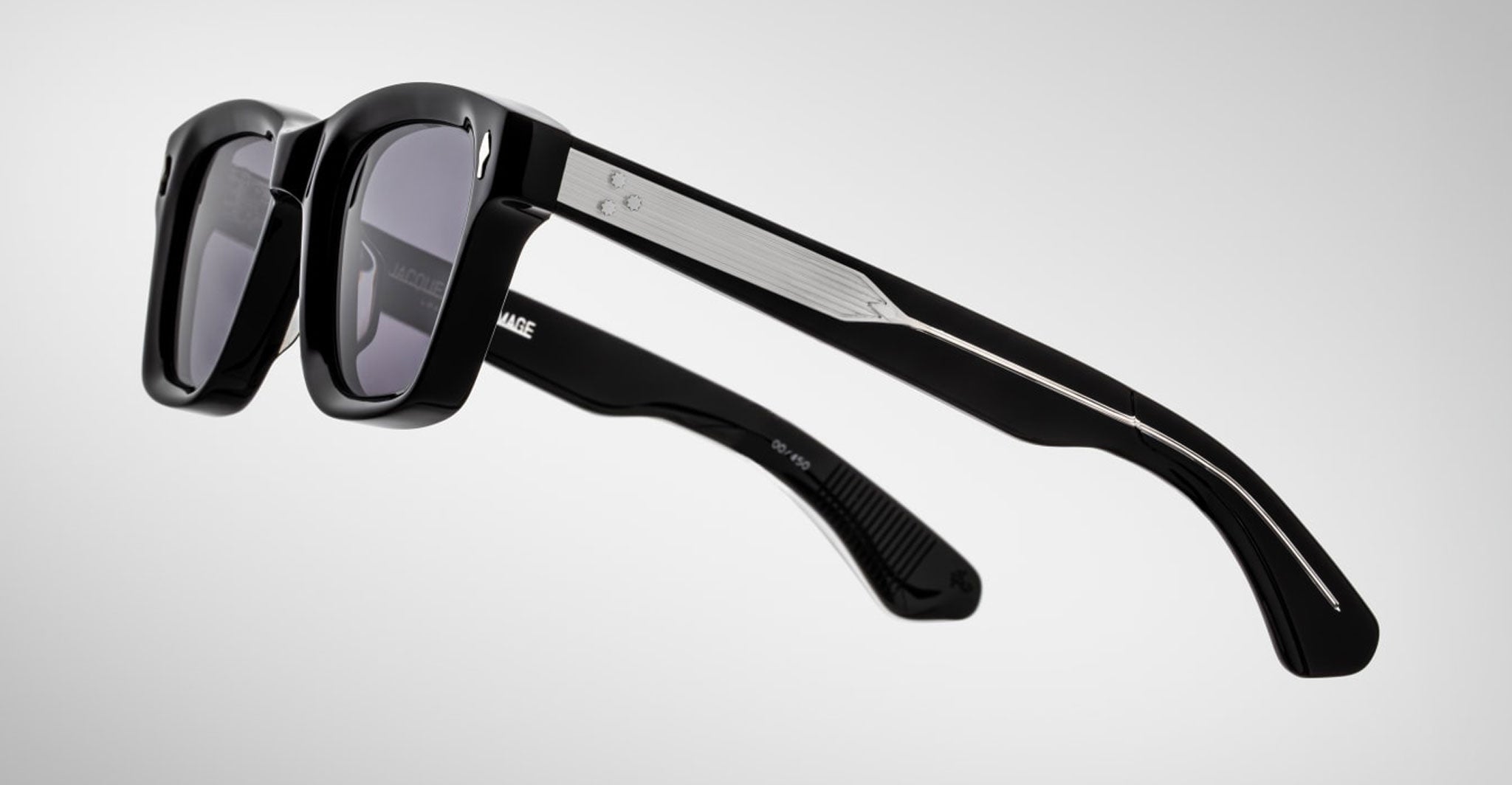 Jacques Marie Mage Sonata black rectangular sunglasses with thick frames and silver arm accents, shown from a front-facing angle.