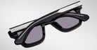 Jacques Marie Mage Sonata black sunglasses with silver accents, folded, shown from above.