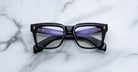 Jacques Marie Mage Torino in Obscure black rectangular eyeglasses with clear lenses, classic full-rim frame, top-down view.