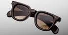 Jacques Marie Mage Vendome in Ganache brown rectangular sunglasses with brown tinted lenses, product shown in close-up front view.