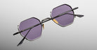 Jacques Marie Mage Verlaine sunglasses with UV-protective dark purple lenses and black frames, front view.