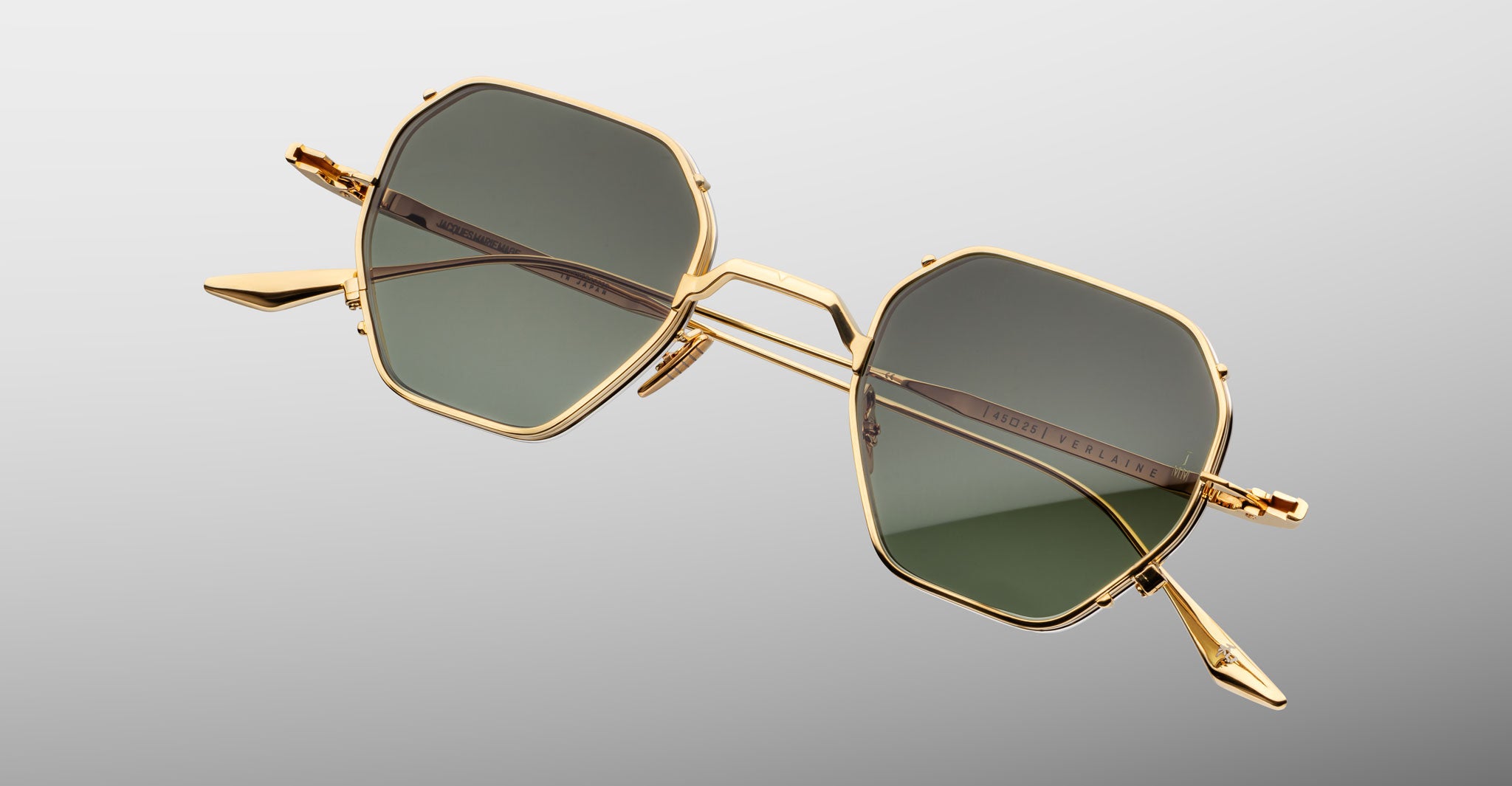 Jacques Marie Mage Verlaine gold hexagonal sunglasses with UV-protective dark green lenses, front view.