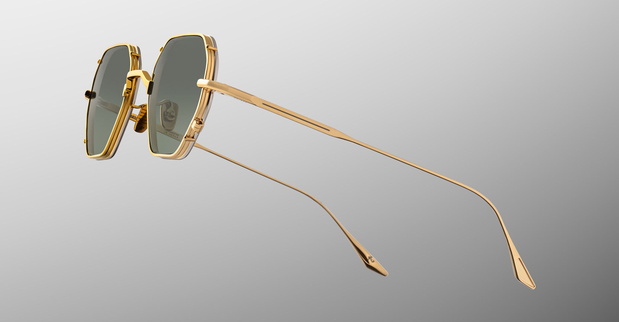 Jacques Marie Mage Verlaine square sunglasses feature gold rims and dark lenses, shown from the front.