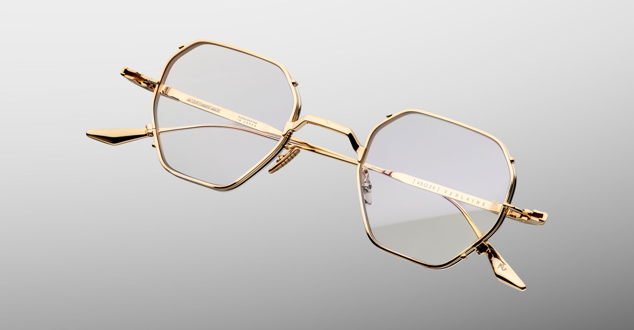 Jacques Marie Mage Verlaine gold geometric eyeglasses with clear lenses, front view, minimalist design.