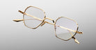 Jacques Marie Mage Verlaine gold geometric eyeglasses with clear lenses, front view, minimalist design.