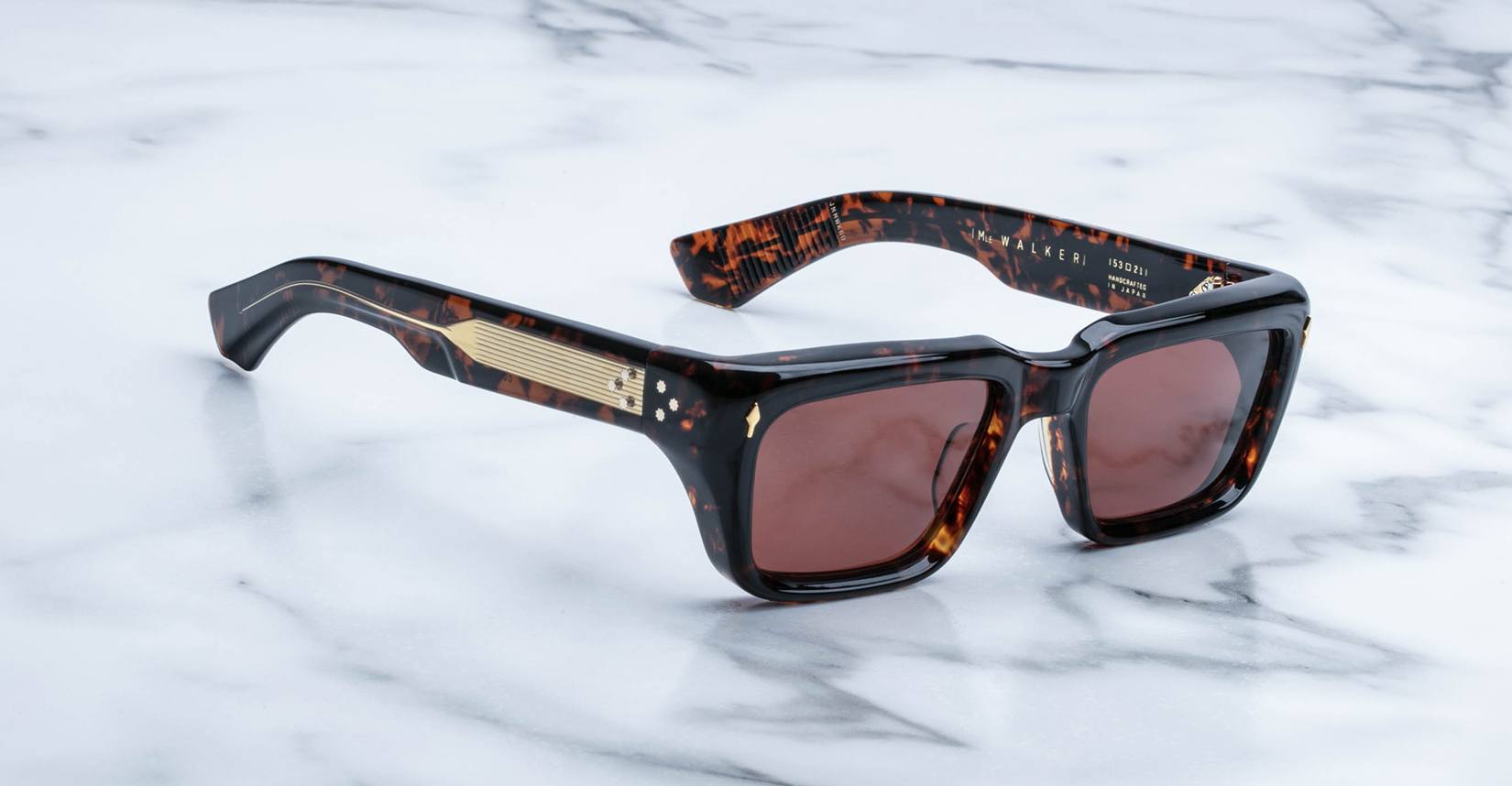 Jacques Marie Mage Walker sunglasses with brown UV lenses shown from above, featuring thick frames.