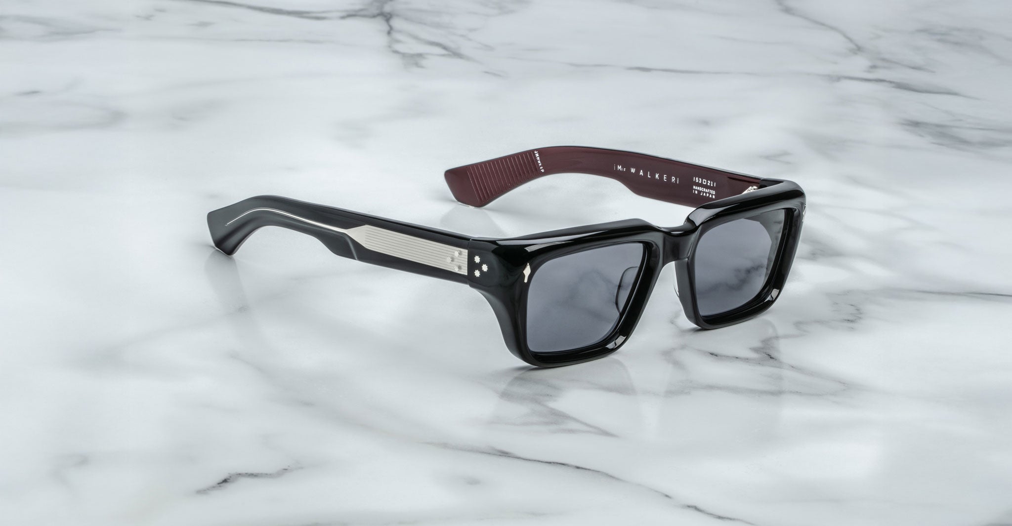 Jacques Marie Mage Walker rectangular sunglasses with thick dark frames, top-view angle.