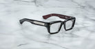 Jacques Marie Mage Walker black rectangular eyeglasses with thick frames and silver accents, front view.