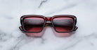 Jacques Marie Mage Walker sunglasses, burgundy frame with red lenses, shown from above.