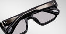 Close-up of Jacques Marie Mage Walker eyeglasses in black with metallic accents, showing frame tech details. Front angle view.