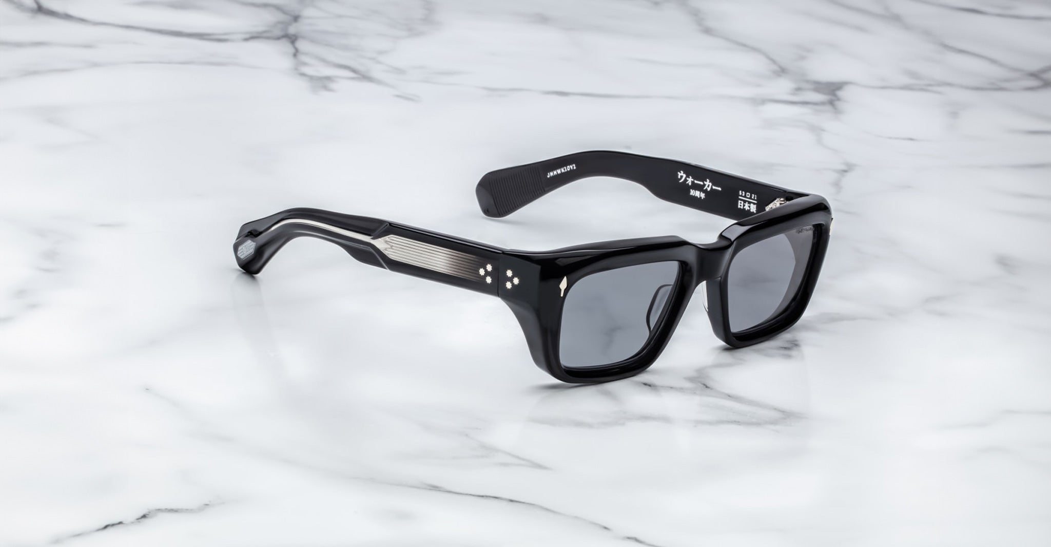 Jacques Marie Mage Walker black rectangular sunglasses with silver-accented arms, top down view.