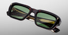 Jacques Marie Mage Walker sunglasses with green lenses, front view, reflecting a ferris wheel in the lenses.