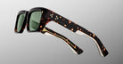 Side view close-up of Jacques Marie Mage Walker round tortoiseshell sunglasses with green lenses.