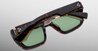 Jacques Marie Mage Walker sunglasses, rectangular shape, brown tortoiseshell frames, green lenses, gold accents, thick temples.