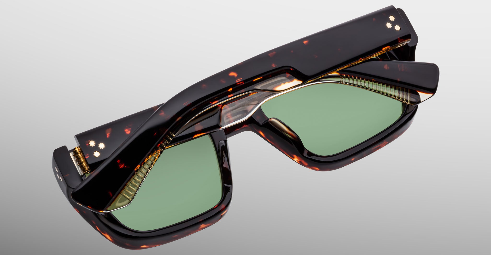 Jacques Marie Mage Walker sunglasses, rectangular shape, brown tortoiseshell frames, green lenses, gold accents, thick temples.
